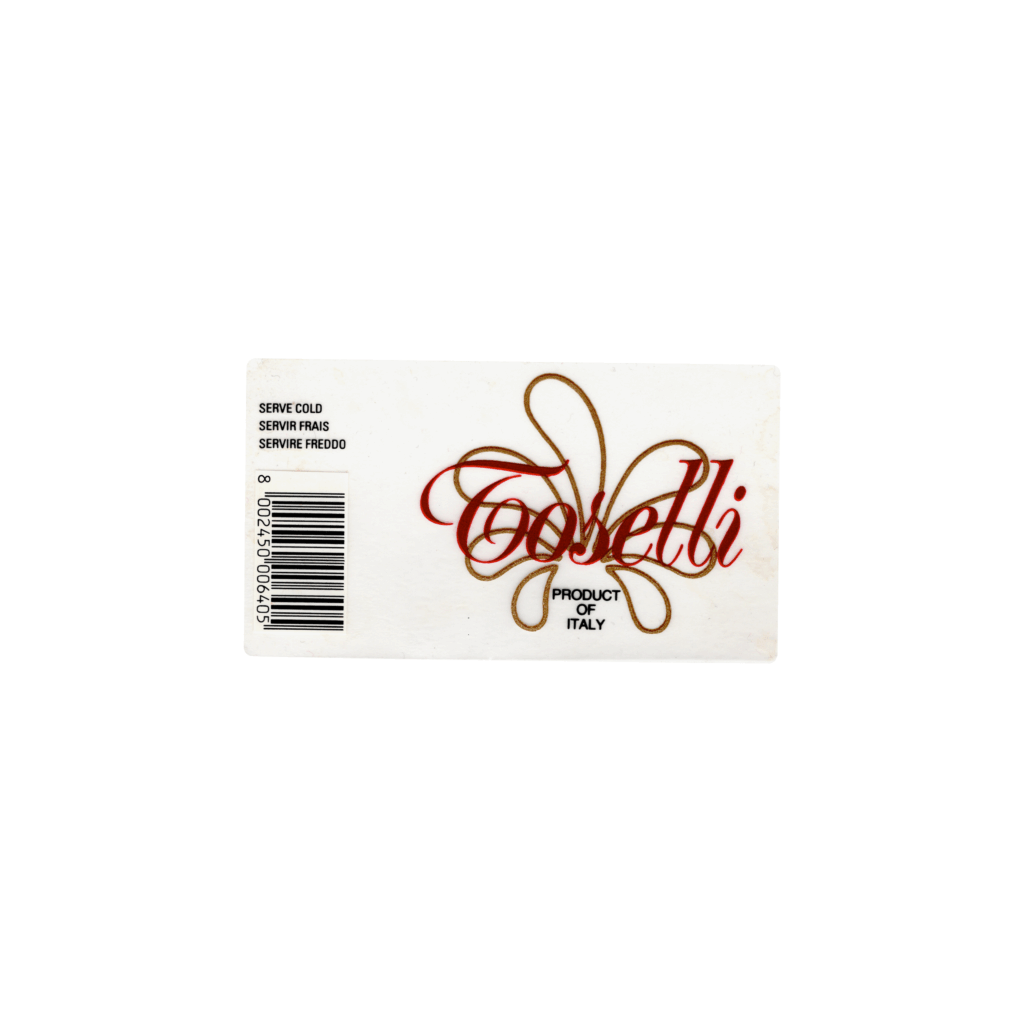 Il N/A Toselli, prodotto a N/A, in Italia, presenta un'etichetta rettangolare realizzata in carta PVC trasparente e stampata con tecnologia flessografica.